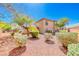 Landscaped backyard featuring gravel and desert foliage under a clear, blue sky at 6916 Dorita Ave # 102, Las Vegas, NV 89108