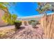 A beautiful backyard featuring desert landscaping, including mature shrubs and gravel ground cover at 6916 Dorita Ave # 102, Las Vegas, NV 89108