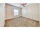 Bedroom with neutral carpet, a ceiling fan, and a bright window with natural light at 6916 Dorita Ave # 102, Las Vegas, NV 89108