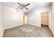 A spacious bedroom features neutral walls, a ceiling fan, and direct access to a walk-in closet at 6916 Dorita Ave # 102, Las Vegas, NV 89108