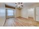 Cozy bedroom with hardwood-style floors, a ceiling fan, and a walk-in closet at 6916 Dorita Ave # 102, Las Vegas, NV 89108