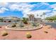Well-manicured community grounds with desert landscaping and decorative circular entrance at 6916 Dorita Ave # 102, Las Vegas, NV 89108