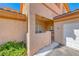 Inviting entrance featuring decorative stonework, desert landscaping, and a private entry gate at 6916 Dorita Ave # 102, Las Vegas, NV 89108