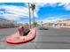 Street view of the community with palm trees and a stone sign marking the entrance at 6916 Dorita Ave # 102, Las Vegas, NV 89108