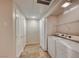 Bright laundry room with tile floors, closet, washer, and dryer at 6916 Dorita Ave # 102, Las Vegas, NV 89108