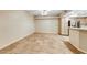 Open living room featuring tile flooring, neutral color palette, and a ceiling fan, creating an airy and spacious feel at 6916 Dorita Ave # 102, Las Vegas, NV 89108