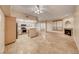 Open floor plan featuring tile flooring, stainless steel appliances, a fireplace, and ample natural light at 6916 Dorita Ave # 102, Las Vegas, NV 89108