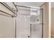 Close-up of the tiled shower featuring glass doors and chrome fixtures at 6916 Dorita Ave # 102, Las Vegas, NV 89108