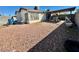 Backyard featuring a gravel ground cover, covered patio, and perimeter fencing at 6955 Grassy Knoll St, Las Vegas, NV 89147