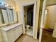 Bright bathroom with modern vanity, ample storage, and an adjacent water closet at 6955 Grassy Knoll St, Las Vegas, NV 89147