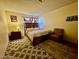 Comfortable bedroom with cozy decor, patterned rug, and wood furnishings at 6955 Grassy Knoll St, Las Vegas, NV 89147