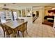 Open dining area with views to the living spaces and a sliding door to the exterior at 6955 Grassy Knoll St, Las Vegas, NV 89147