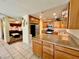 Functional kitchen featuring stainless steel appliances and an adjacent living area at 6955 Grassy Knoll St, Las Vegas, NV 89147
