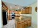 Updated kitchen with stainless steel appliances and granite countertops and plenty of cabinets at 6955 Grassy Knoll St, Las Vegas, NV 89147