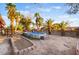 Palm tree-lined backyard with an above-ground pool and desert landscaping offering a private oasis at 711 Sari Dr, Las Vegas, NV 89110