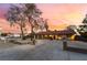 Wide driveway leading up to charming home with well-maintained landscaping and ample parking at 711 Sari Dr, Las Vegas, NV 89110