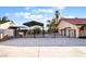 Gated property with a metal canopy structure provides ample parking and privacy at 711 Sari Dr, Las Vegas, NV 89110