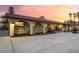 Stunning exterior view with covered archways and meticulously maintained landscaping at 711 Sari Dr, Las Vegas, NV 89110