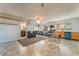 Spacious kitchen featuring stainless steel appliances, wood cabinets, and a connected dining area at 711 Sari Dr, Las Vegas, NV 89110