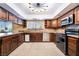 U-shaped kitchen with granite countertops and stainless steel appliances offers functionality and style at 711 Sari Dr, Las Vegas, NV 89110