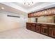 Open concept area showcasing the dark cabinetry and tile flooring at 711 Sari Dr, Las Vegas, NV 89110
