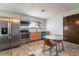 Updated kitchen features modern appliances, light cabinets, and a cozy breakfast nook at 711 Sari Dr, Las Vegas, NV 89110