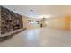 Spacious living room featuring a stone fireplace and tiled flooring at 711 Sari Dr, Las Vegas, NV 89110