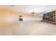 Living room showcases stone fireplace and tile floors, with kitchen view at 711 Sari Dr, Las Vegas, NV 89110