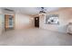 Bright living room features tile flooring, large windows, and a neutral color palette at 711 Sari Dr, Las Vegas, NV 89110