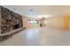 Spacious living room featuring a stone fireplace and tiled flooring at 711 Sari Dr, Las Vegas, NV 89110