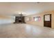 Open living room featuring a unique stone fireplace and tiled floors at 711 Sari Dr, Las Vegas, NV 89110