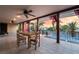 Covered patio with outdoor dining area overlooking the pool and serene backyard at 711 Sari Dr, Las Vegas, NV 89110