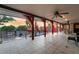 Spacious patio with ceiling fans, overlooking a pool and lush backyard, perfect for entertaining at 711 Sari Dr, Las Vegas, NV 89110