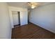 Bedroom with ceiling fan, closet, and wood-look flooring at 7200 Pirates Cove Rd # 2025, Las Vegas, NV 89145