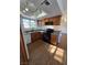Well-lit kitchen showcasing wood cabinets, granite countertops, and stainless steel appliances at 7200 Pirates Cove Rd # 2025, Las Vegas, NV 89145