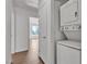 Stacked washer and dryer in a bright laundry area near bedrooms at 7200 Pirates Cove Rd # 2025, Las Vegas, NV 89145