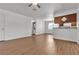 Open-concept living room features wood-look floors and transitions to a breakfast bar and kitchen at 7200 Pirates Cove Rd # 2025, Las Vegas, NV 89145