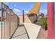 Well-maintained pool area featuring shade structure and convenient outdoor shower area at 7200 Pirates Cove Rd # 2025, Las Vegas, NV 89145