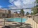 View of the community pool, featuring a clear blue pool and surrounding fencing at 7200 Pirates Cove Rd # 2025, Las Vegas, NV 89145