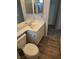 This bathroom has wood look floors, a sink and toilet at 734 Rusty Spur Dr, Henderson, NV 89014