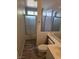 Bathroom featuring wood look floors, a shower over tub and a toilet at 734 Rusty Spur Dr, Henderson, NV 89014