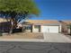 Charming single-story home featuring a well-maintained yard and inviting curb appeal at 734 Rusty Spur Dr, Henderson, NV 89014