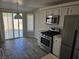 Functional kitchen features updated appliances and access to the patio for outdoor dining at 734 Rusty Spur Dr, Henderson, NV 89014