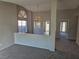 Open-concept living room offering plush carpeting and views to the kitchen and other living spaces at 734 Rusty Spur Dr, Henderson, NV 89014