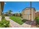 Well maintained backyard featuring artificial turf, brick pavers, mature landscaping, and a storage shed at 7473 Deschutes Cir, Las Vegas, NV 89129