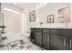 Well appointed bathroom with bath tub, shower, and double vanity with framed mirror at 7473 Deschutes Cir, Las Vegas, NV 89129