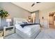 This primary bedroom offers a ceiling fan, plush carpet and stylish furnishings at 7473 Deschutes Cir, Las Vegas, NV 89129