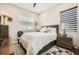 Comfortable secondary bedroom with ceiling fan and lots of natural light at 7473 Deschutes Cir, Las Vegas, NV 89129
