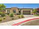 Charming single-story home featuring a stone facade and a two-car garage at 7473 Deschutes Cir, Las Vegas, NV 89129