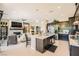 Open kitchen seamlessly flowing into a living area, boasting an island and modern appliances at 7473 Deschutes Cir, Las Vegas, NV 89129
